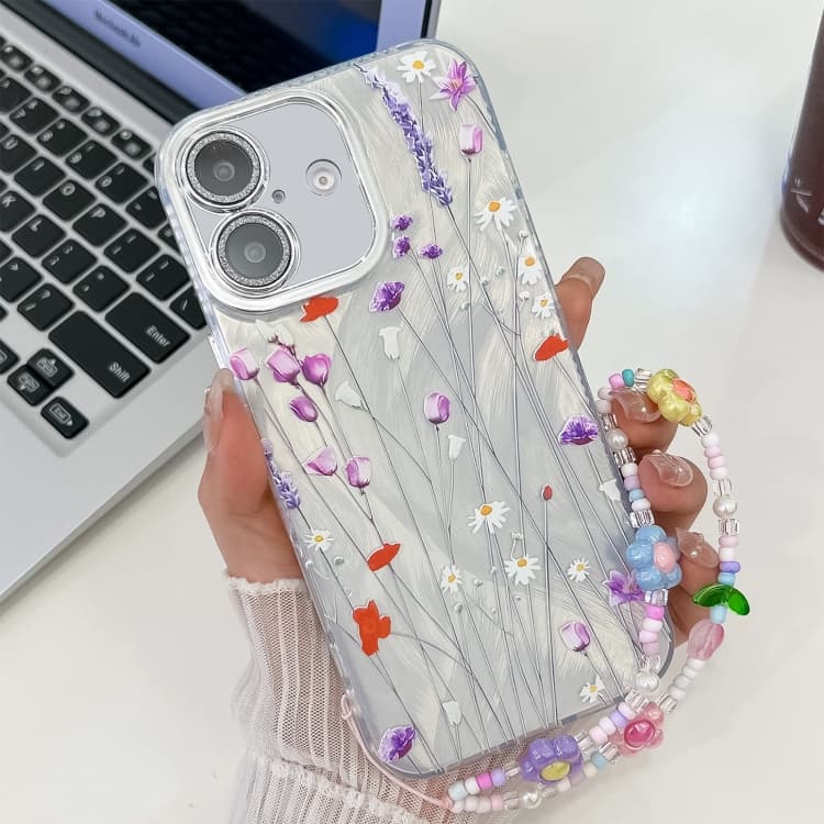 For iPhone 16 Electroplating Flower Texture Wristband TPU Phone Case(Purple Wildflowers SH1) - Immagine 1