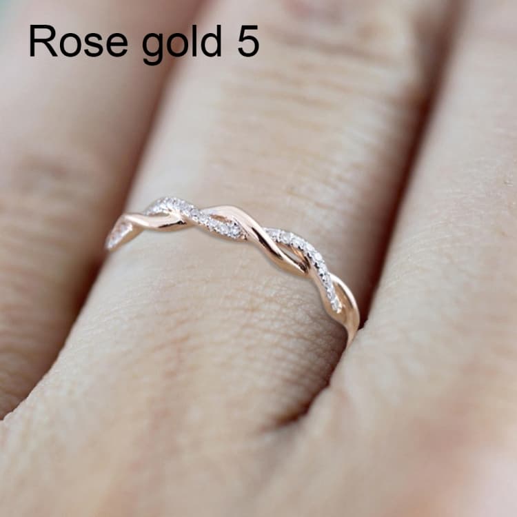 Anello classico da donna a forma di torsione con zirconia cubica, colore: oro rosa (5) - Immagine 1